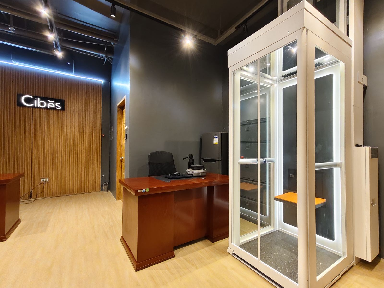 Cibes Lift Cagayan de Oro Experience Center featuring a modern home lift display, reception desks, and premium showroom interior.
